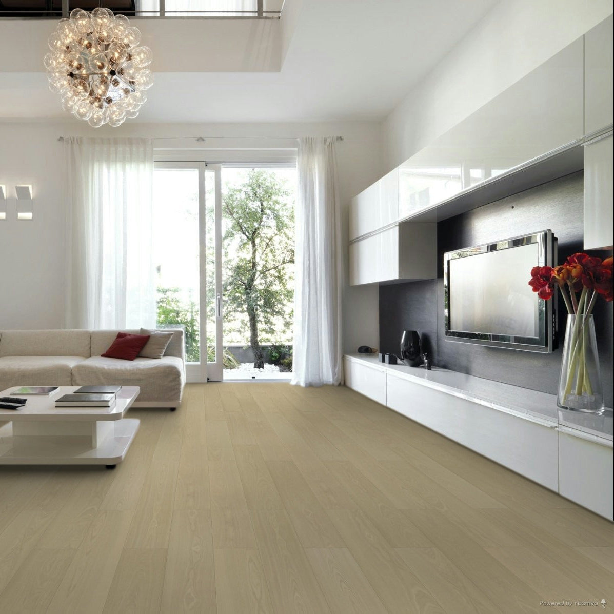 Modern living room with a chandelier, sofa, coffee table, and TV. Lakeside Park Paddle laminate.