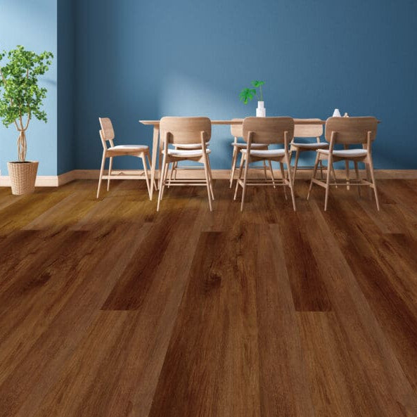 Dining area with wooden table and chairs against a blue wall.