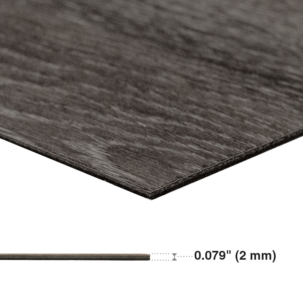Close-up of a dark brown material with a measurement label indicating plank thickness. Beaulieu Aerial Squamish.