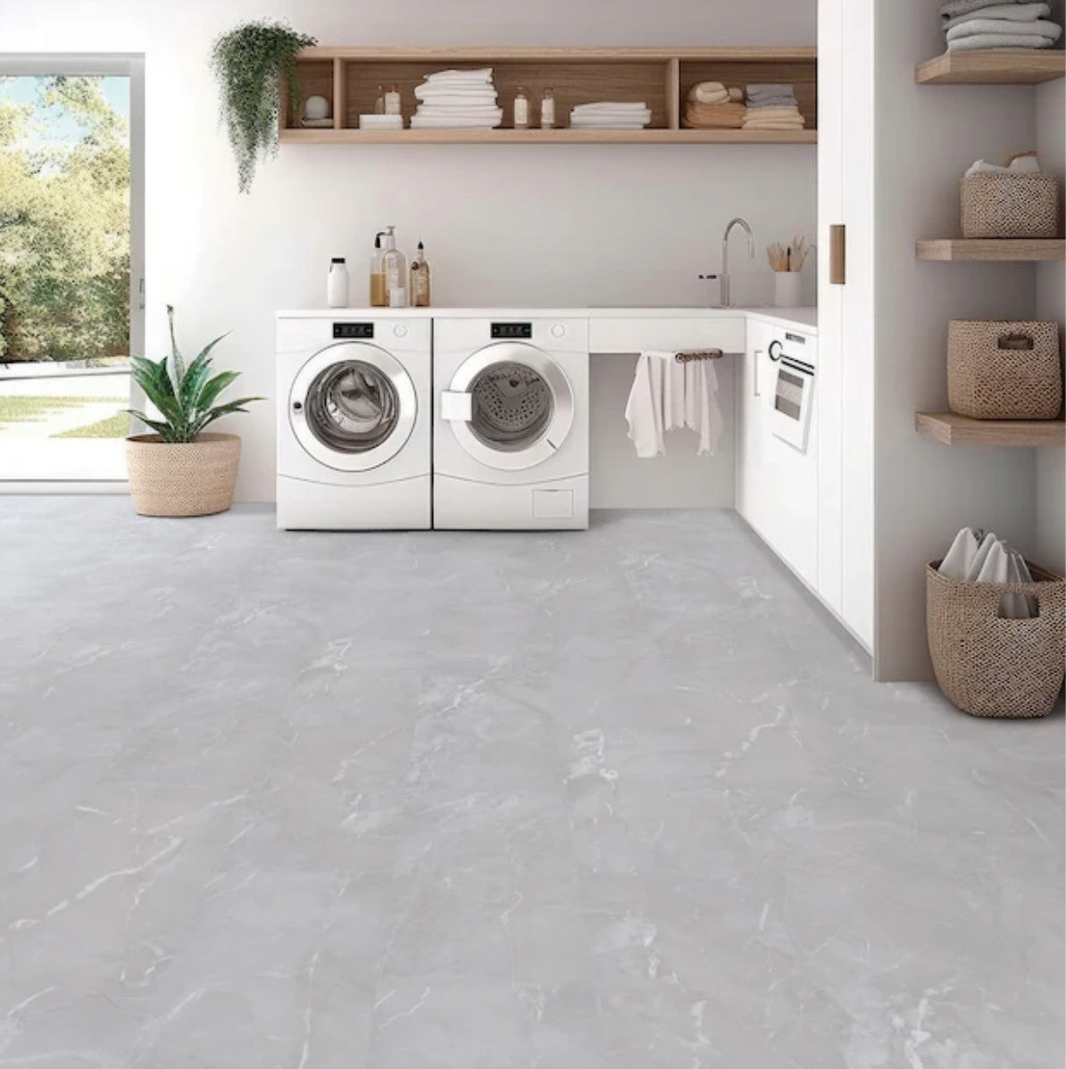 Modern laundry room with white washing machines and a gray tiled floor. BiYork Hydrogen 6 Thunder luxury vinyl tile flooring.