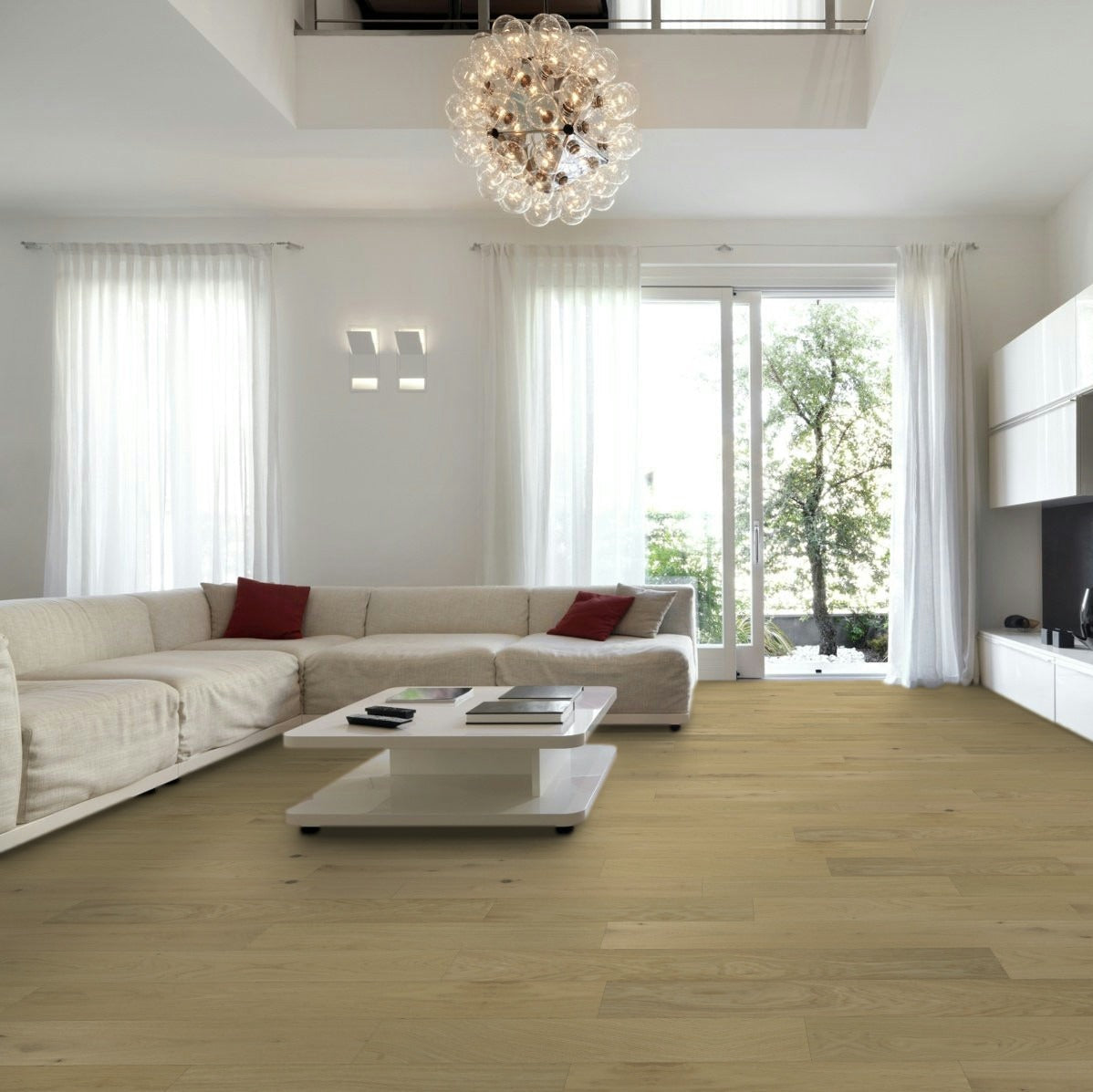 Modern living room with a white sofa, coffee table, and decorative items. Timbermill Natural Timber hardwood flooring.
